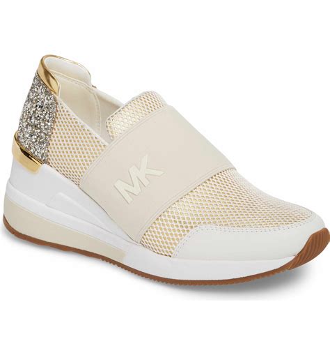 michael kors slip on train|Michael Kors rose gold sneakers.